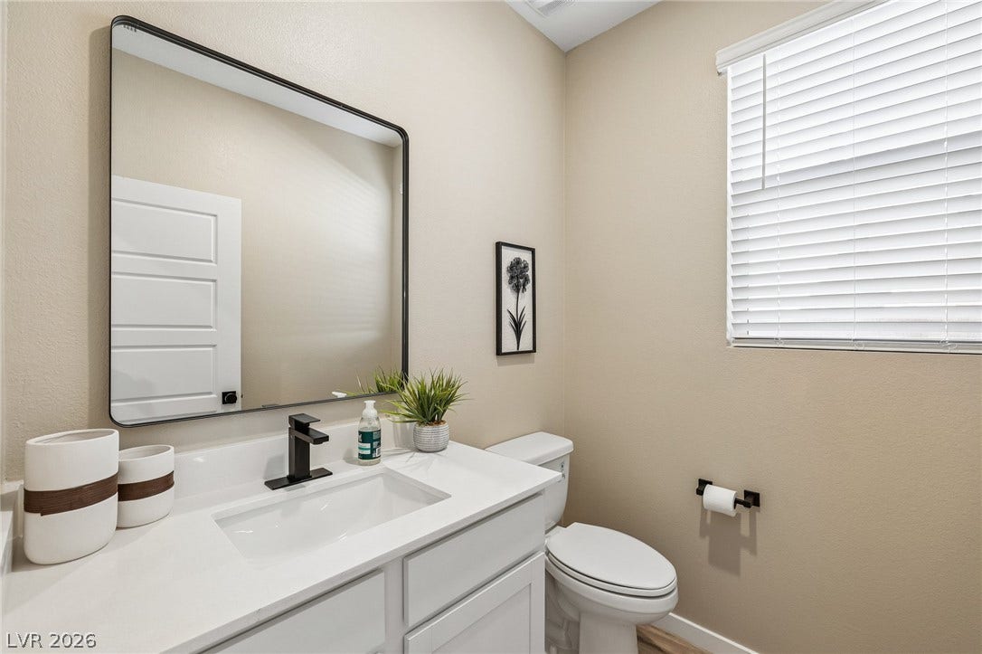 194 Viento Ridge Street, Henderson, NV 89012 Clean lines and a modern vanity define this elegant half bath.