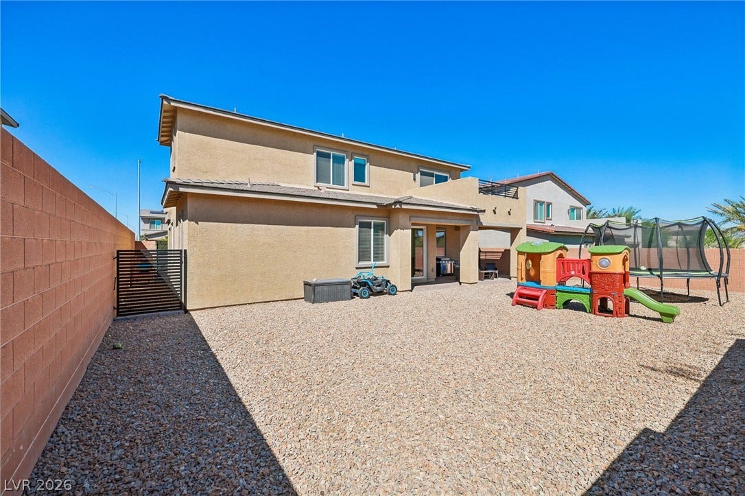 194 Viento Ridge Street, Henderson, NV 89012 An enclosed backyard features a low-maintenance gravel surface and high privacy block walls.
