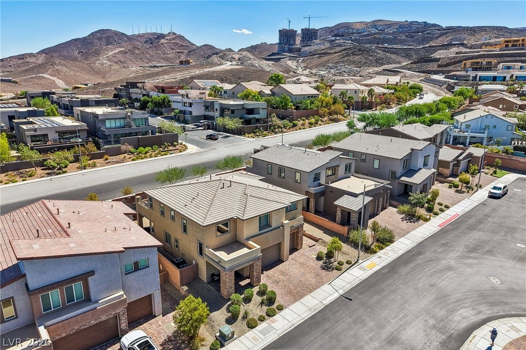 194 Viento Ridge Street, Henderson, NV 89012 Striking desert mountains form a dramatic backdrop for this modern hillside neighborhood.