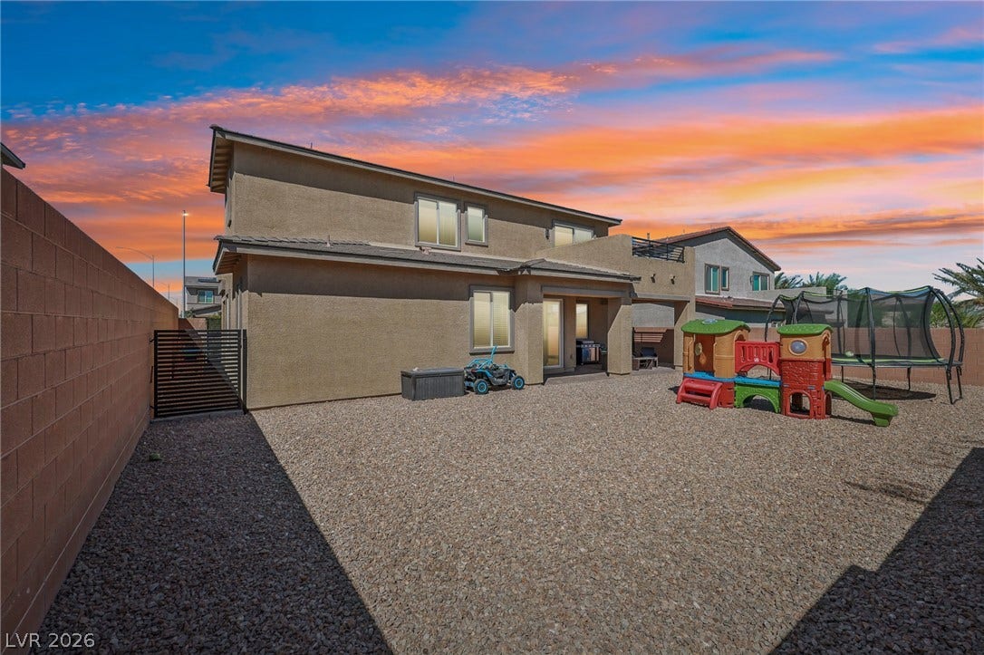 194 Viento Ridge Street, Henderson, NV 89012 A spacious gravel backyard offers low-maintenance outdoor living bordered by a privacy block wall.