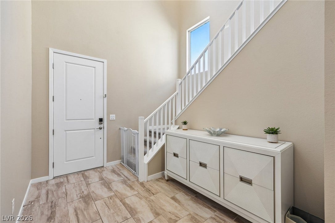194 Viento Ridge Street, Henderson, NV 89012 High ceilings and durable tile flooring welcome visitors into this bright, airy entryway.