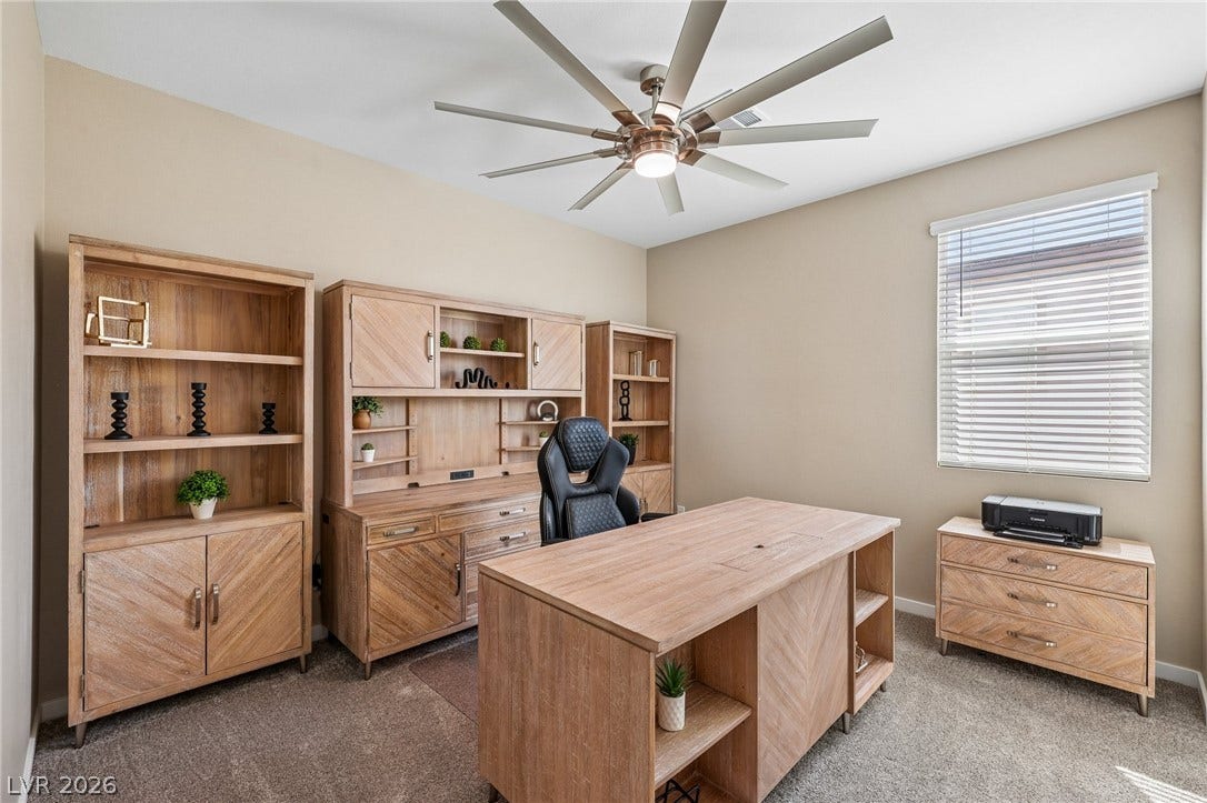 194 Viento Ridge Street, Henderson, NV 89012 Plentiful natural light and plush carpeting define this versatile home workspace.