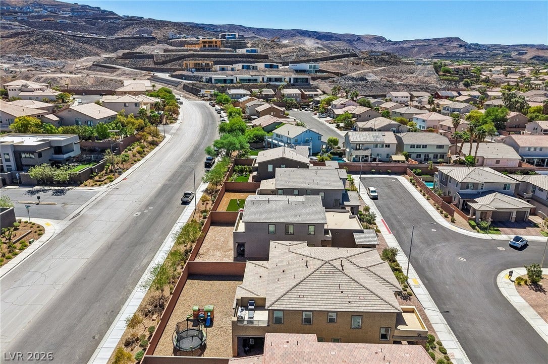 194 Viento Ridge Street, Henderson, NV 89012 An aerial perspective showcases the surrounding neighborhood nestled against scenic desert hills.