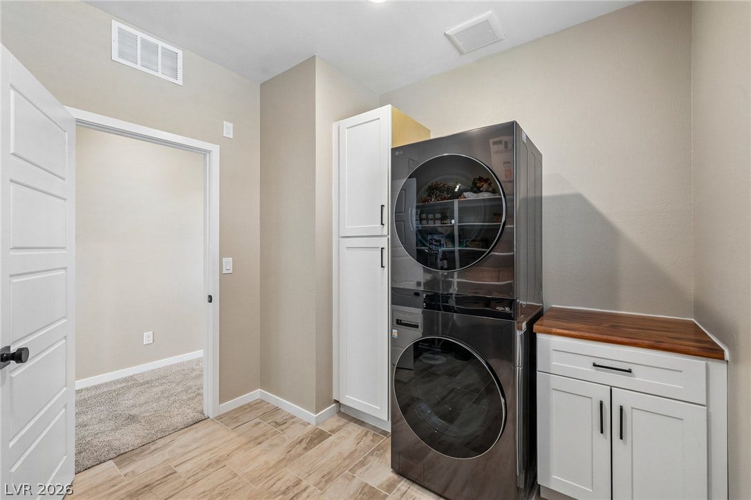 194 Viento Ridge Street, Henderson, NV 89012 Functional cabinetry and clean flooring maximize utility in this modern utility space.