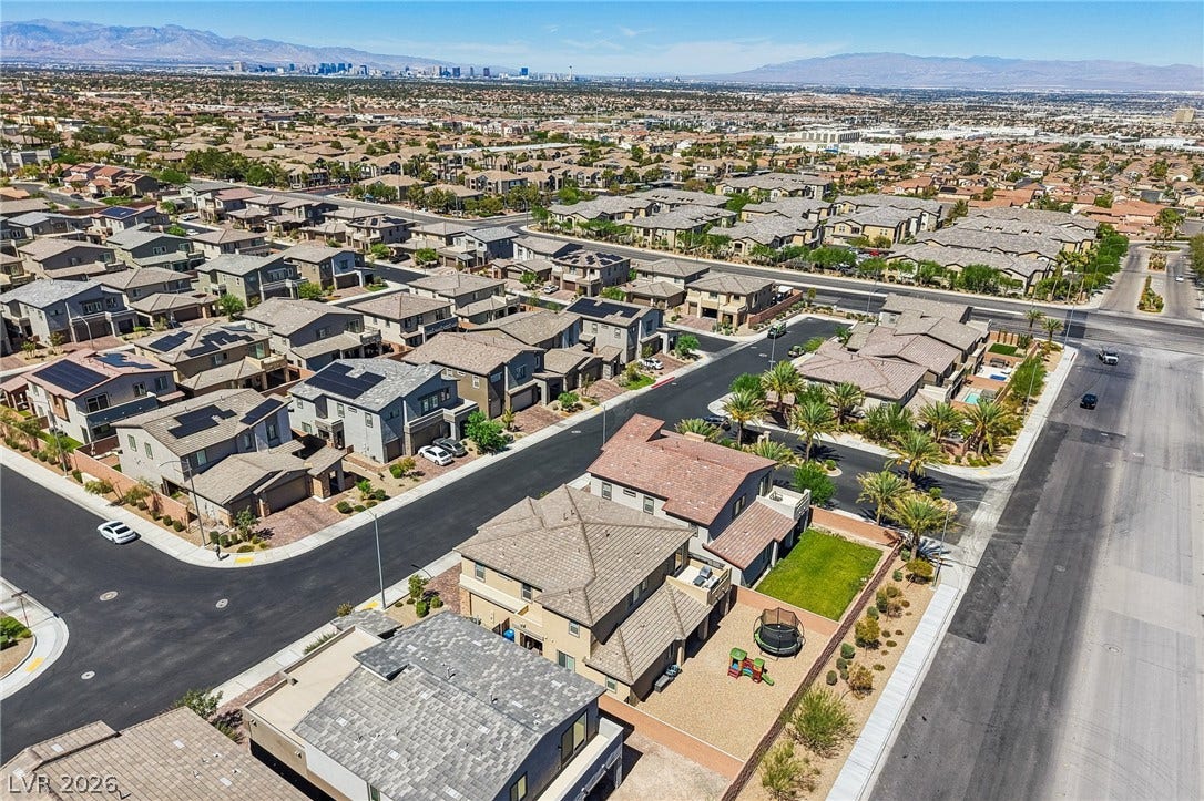 194 Viento Ridge Street, Henderson, NV 89012 Aerial view showcases a modern suburban neighborhood set against a distant mountain backdrop.
