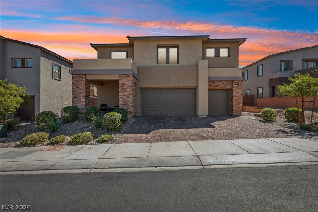 194 Viento Ridge Street, Henderson, NV 89012 Striking contemporary architecture highlights this multi-level exterior accented by warm stone detailing.