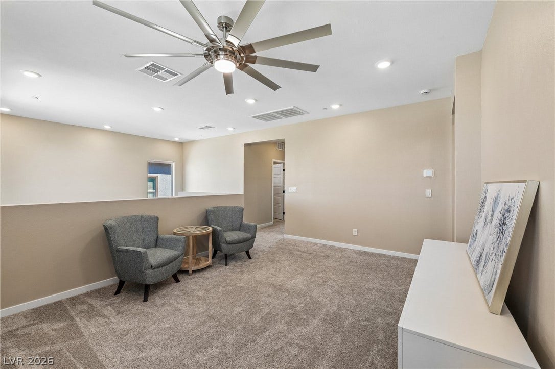 194 Viento Ridge Street, Henderson, NV 89012 Recessed lighting and plush carpeting define this versatile upper-level loft space.