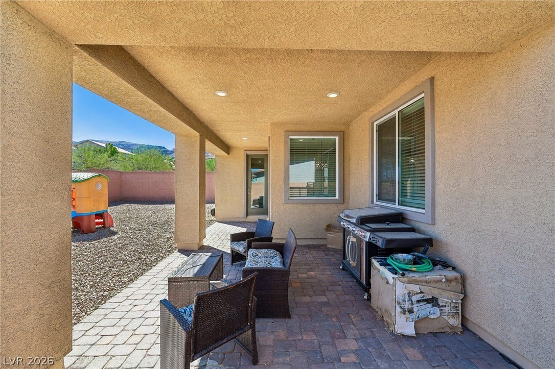194 Viento Ridge Street, Henderson, NV 89012 Recessed lighting illuminates this covered patio area overlooking the back yard.