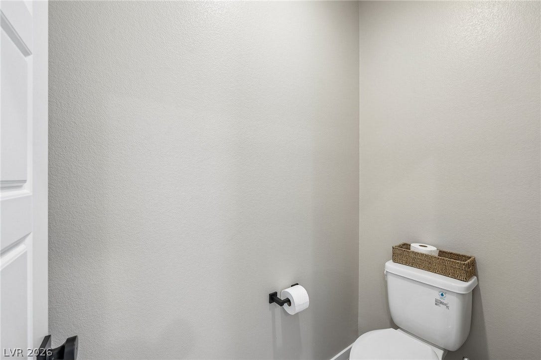 194 Viento Ridge Street, Henderson, NV 89012 A private water closet showcases clean lines and smooth neutral walls.