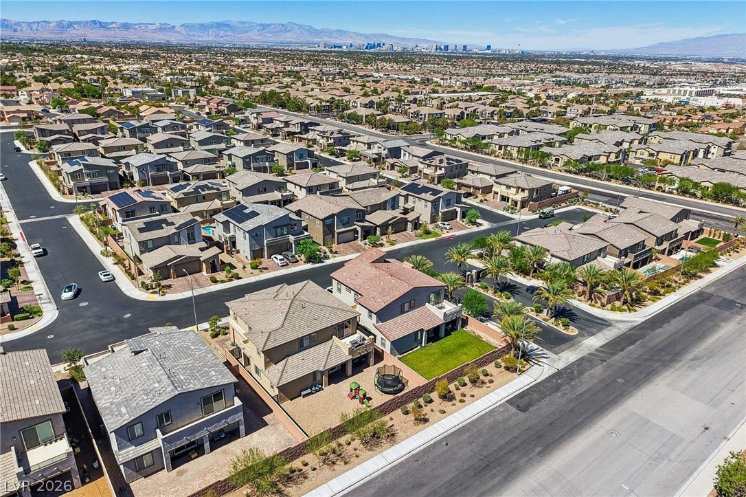 194 Viento Ridge Street, Henderson, NV 89012 Distant mountains frame this sprawling suburban neighborhood lined with neatly paved streets and tile-roofed homes.
