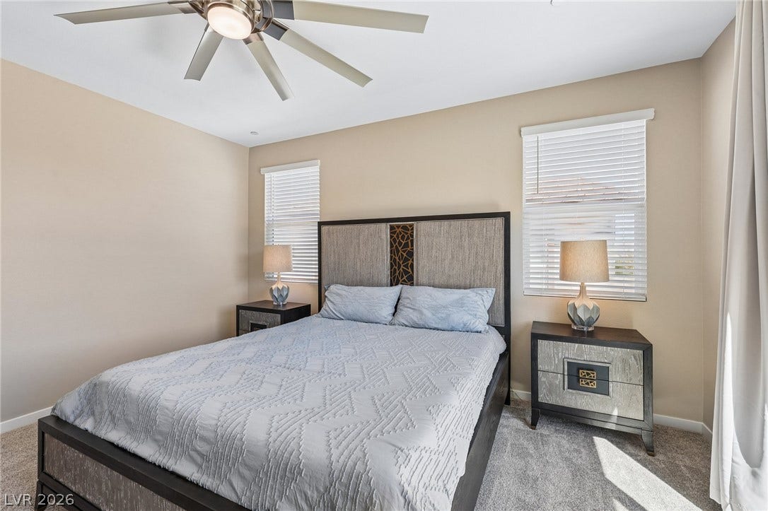 194 Viento Ridge Street, Henderson, NV 89012 Plentiful natural light streams across wall-to-wall carpeting in this comfortable bedroom space.