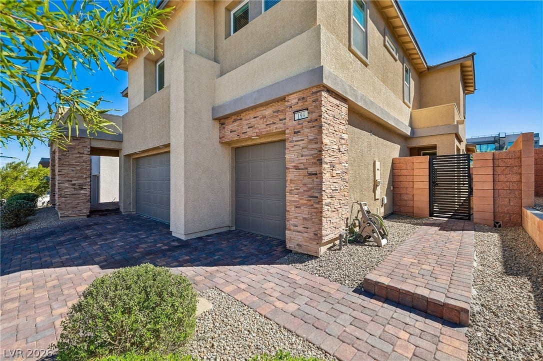 194 Viento Ridge Street, Henderson, NV 89012 A paved driveway and stone accents welcome you to this multi-level home.
