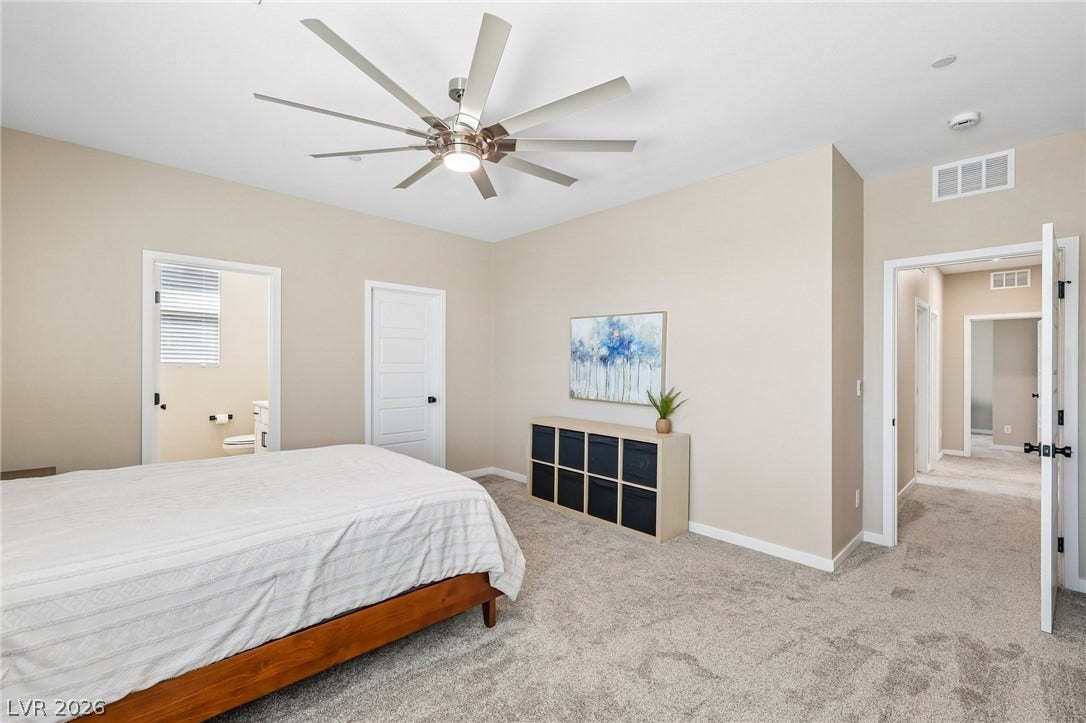 194 Viento Ridge Street, Henderson, NV 89012 Soft carpeting pairs with neutral walls to create a restful, comfortable main suite atmosphere.