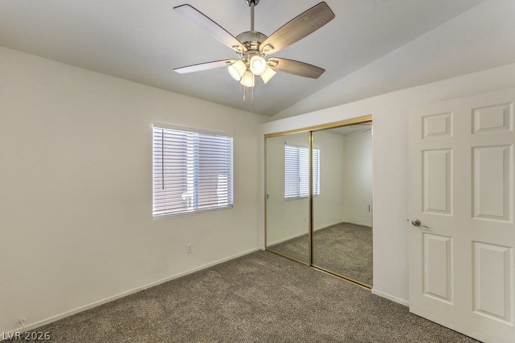 3186 CASTLE CANYON Avenue, Henderson, NV 89052 Vaulted ceilings and plush carpeting define this comfortable bedroom space.