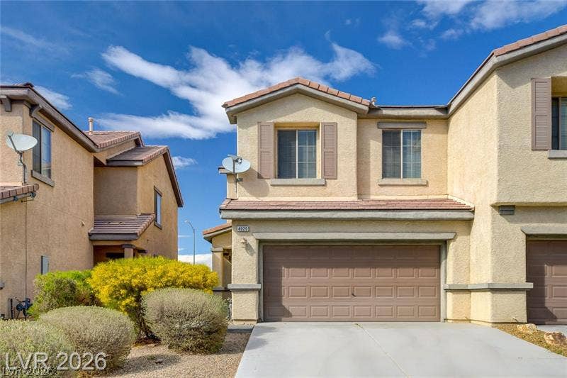 4020 Thomas Patrick Avenue, North Las Vegas, NV 89032 Tiled roofs and structured stucco facades define this multi-level residential design.