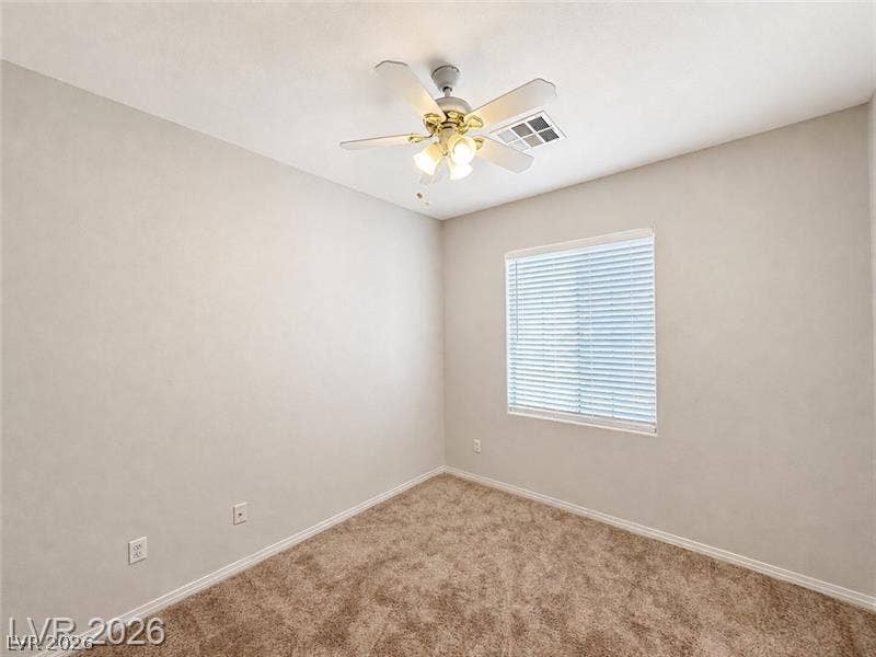 4020 Thomas Patrick Avenue, North Las Vegas, NV 89032 Plush carpeting and a wide window create a comfortable, inviting bedroom retreat.