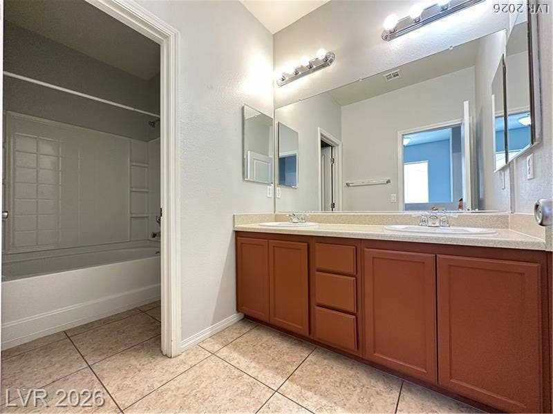 4020 Thomas Patrick Avenue, North Las Vegas, NV 89032 Double vanities and classic cabinetry anchor this functional layout.