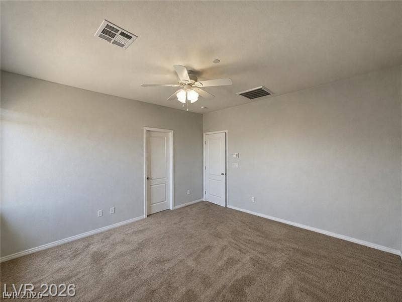 4020 Thomas Patrick Avenue, North Las Vegas, NV 89032 Plush carpeting and clean architectural lines define this versatile secondary bedroom space.