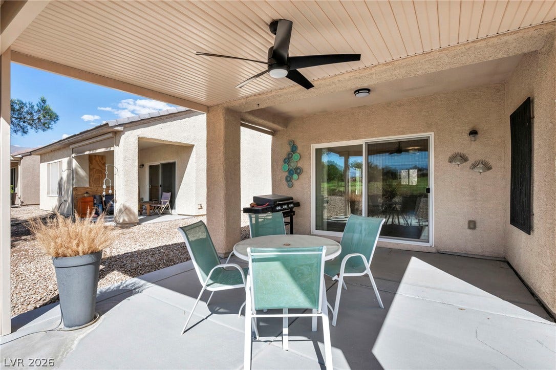 Shaded outdoor living is made easy with this covered concrete patio space.