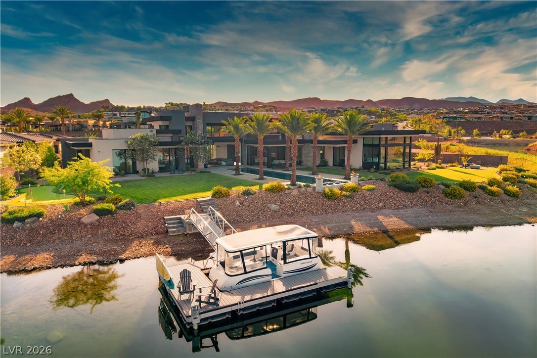 10 Sunrise Beach Circle, Henderson, NV 89011 A private boat dock provides direct access to the water from this contemporary lakeside estate