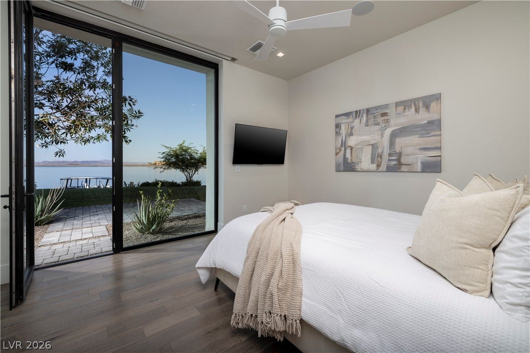 10 Sunrise Beach Circle, Henderson, NV 89011 Bedroom with lakeviews, ensuite spa bathroom, and walkin closet