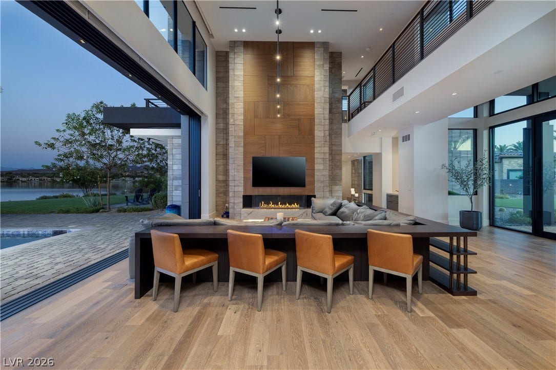 10 Sunrise Beach Circle, Henderson, NV 89011 Walnut flooring, stone/wood wall features, and disappearing glass slider to bring the outside in.