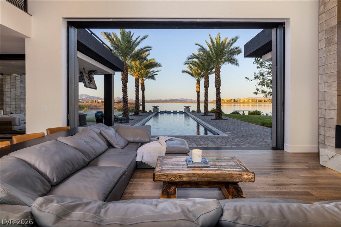 10 Sunrise Beach Circle, Henderson, NV 89011 Disappearing glass walls frame the resort landscaping and lakeviews