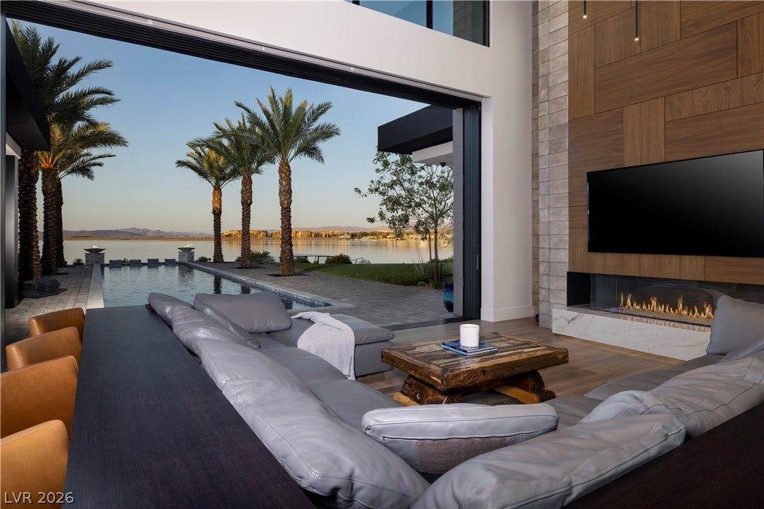 10 Sunrise Beach Circle, Henderson, NV 89011 Glass walls pocket seamlessly to frame the views of the lake and desert mountains