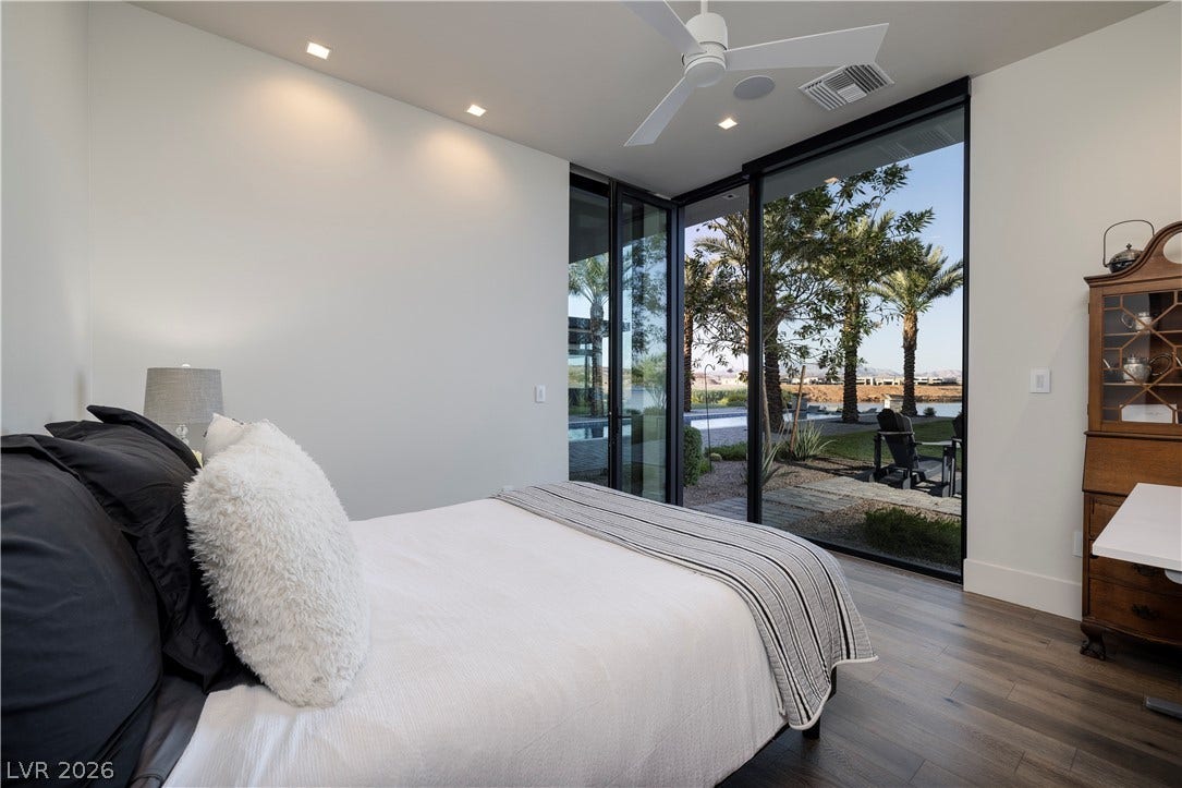10 Sunrise Beach Circle, Henderson, NV 89011 Bedroom with lakeviews, ensuite spa bathroom, and walkin closet