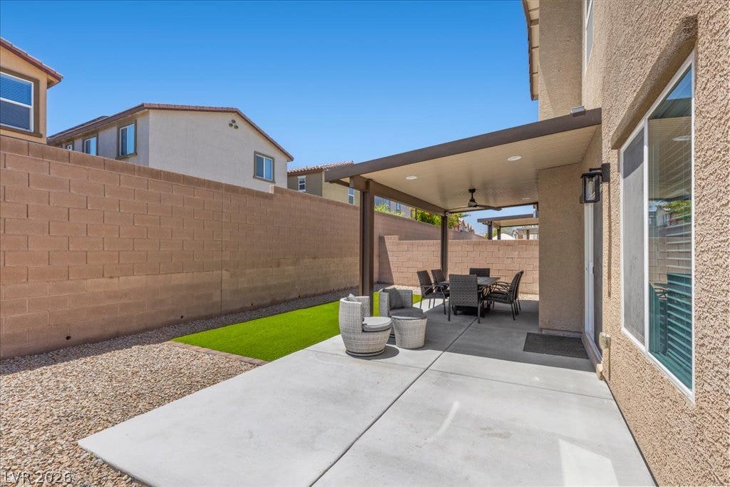 Unwind in the open-air covered patio, extending living outdoors for relaxation and entertaining.