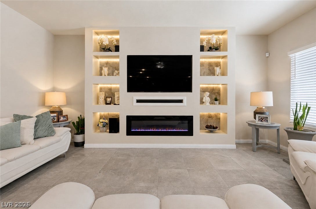 Built-in media center with fireplace provides a focal point in this welcoming gathering space.