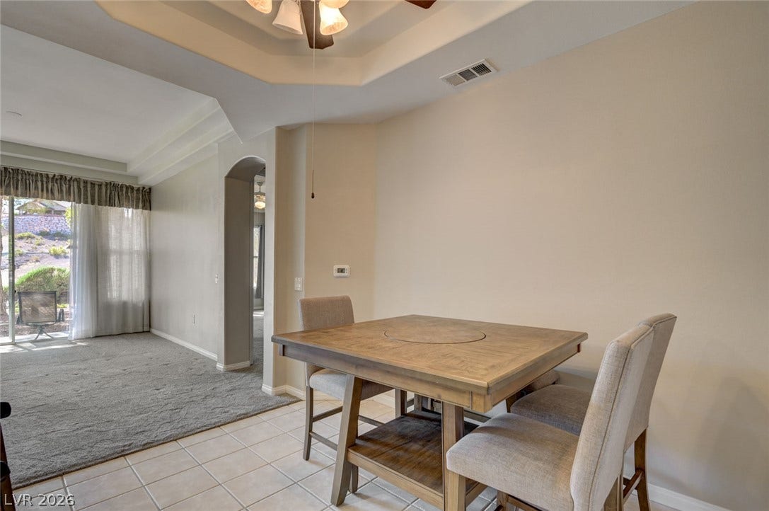 207 Kaelyn Street, #5, Boulder City, NV 89005 Tiled flooring transitions seamlessly to carpeted living space beneath a tray ceiling.