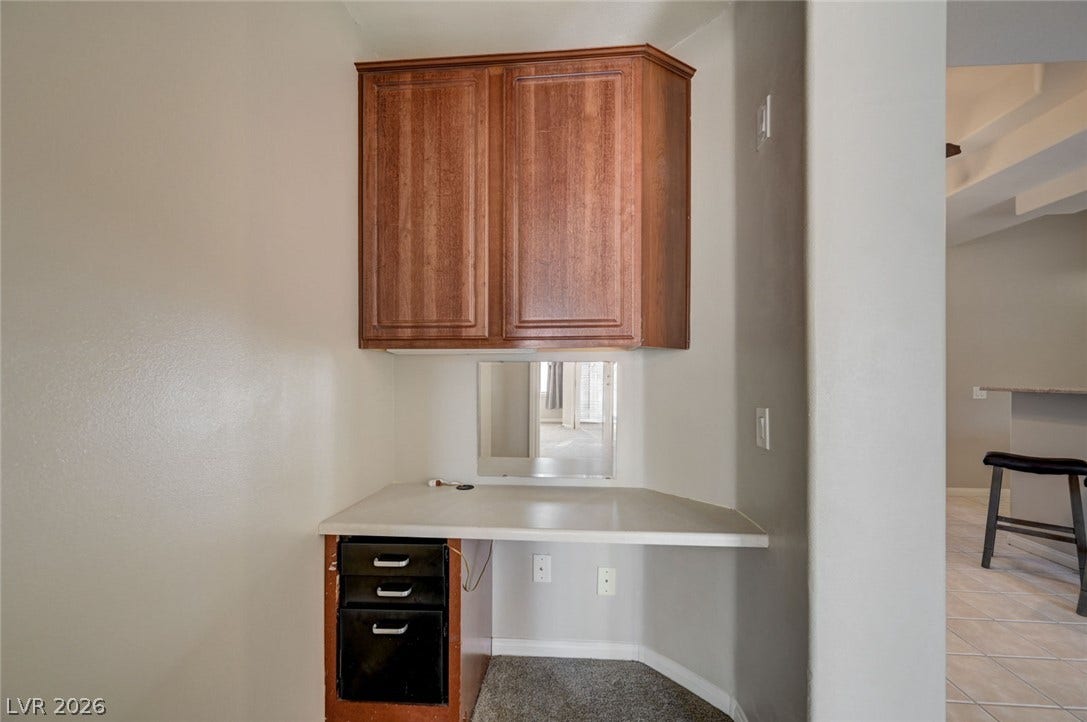 207 Kaelyn Street, #5, Boulder City, NV 89005 A dedicated built-in desk alcove features custom cabinetry and durable carpet flooring.
