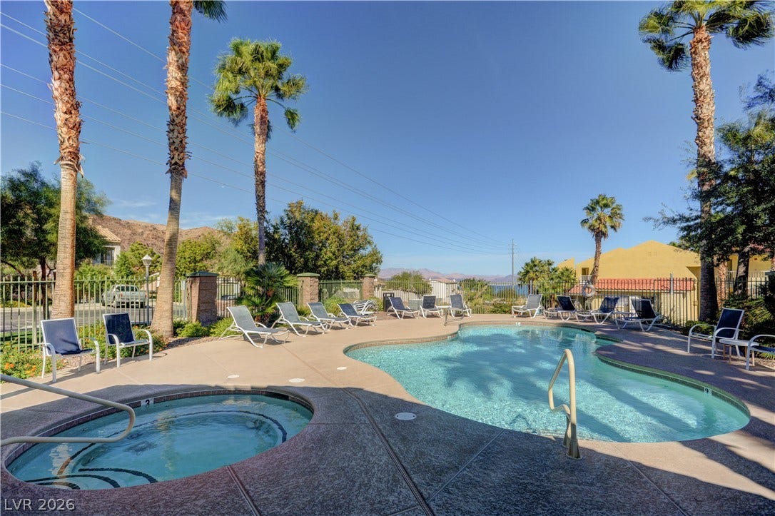 207 Kaelyn Street, #5, Boulder City, NV 89005 Soak in the sun beside a sparkling swimming pool and an adjacent hot tub.