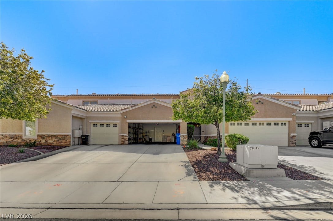 207 Kaelyn Street, #5, Boulder City, NV 89005 An inviting exterior features a concrete driveway leading to a multi-car garage.