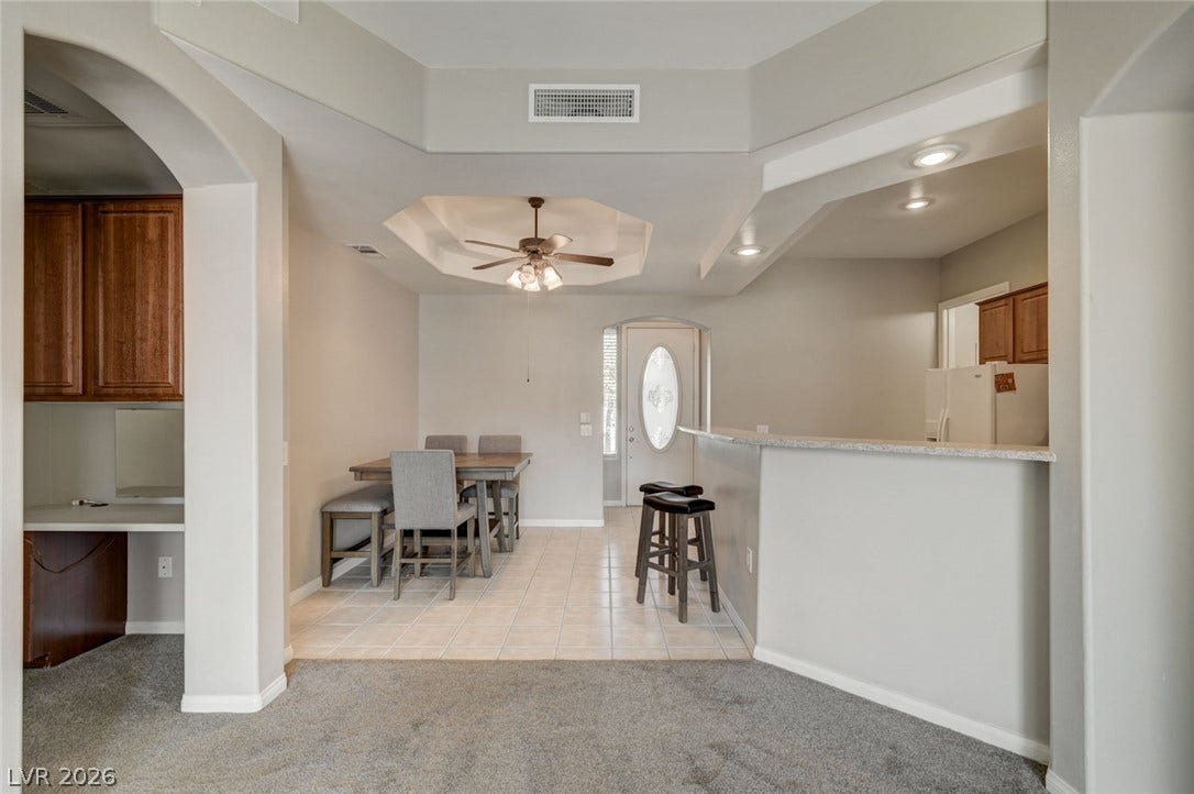 207 Kaelyn Street, #5, Boulder City, NV 89005 An open layout connects the tile-floored dining area to a breakfast bar configuration.