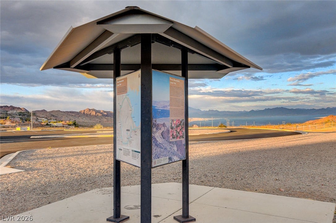 207 Kaelyn Street, #5, Boulder City, NV 89005 Scenic trail maps stand before distant desert mountains under a wide sky.