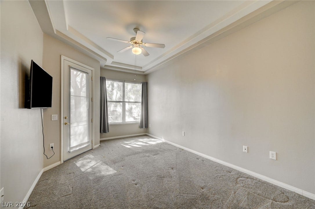 207 Kaelyn Street, #5, Boulder City, NV 89005 A tray ceiling and plush carpeting define this versatile living space.