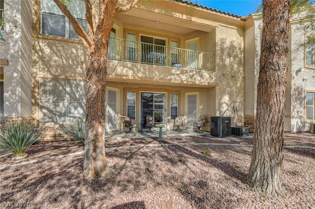 207 Kaelyn Street, #5, Boulder City, NV 89005 Mature trees shade a private patio and balcony overlooking a low-maintenance gravel yard.