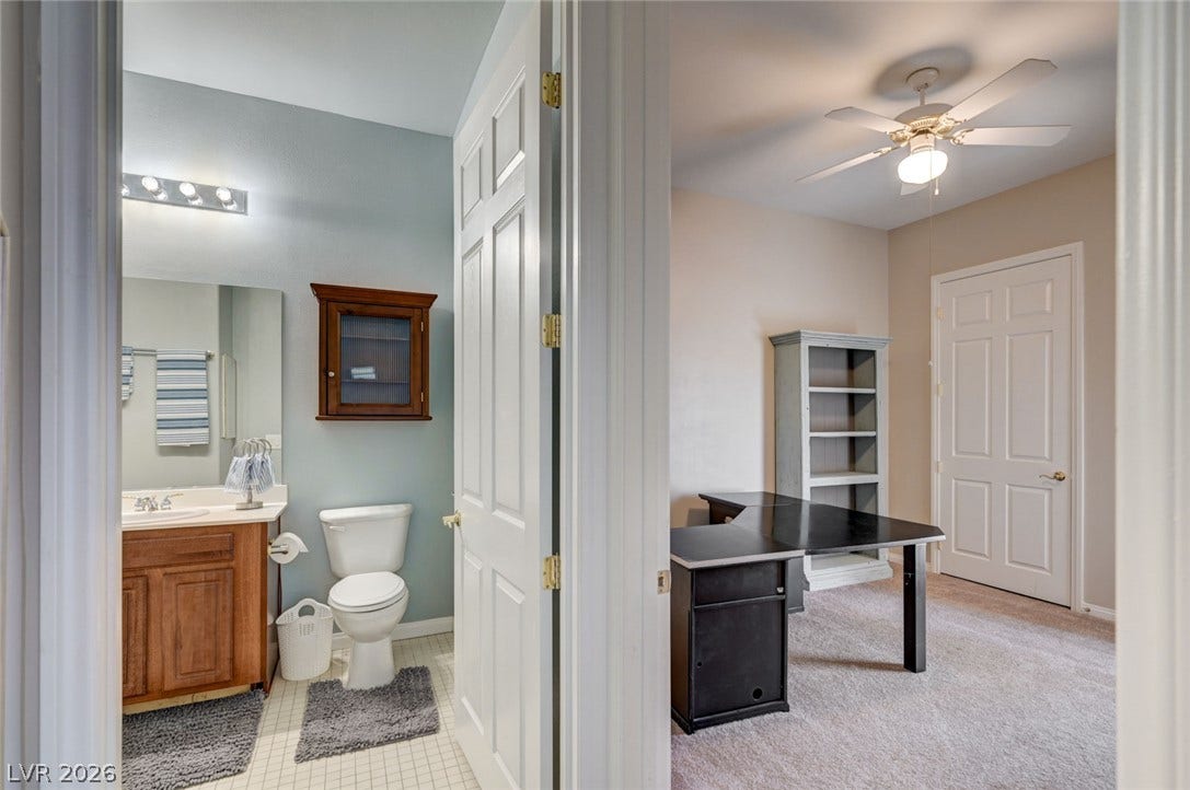 207 Kaelyn Street, #5, Boulder City, NV 89005 Smooth tiled floors and carpeting define these functional, neighboring household spaces.