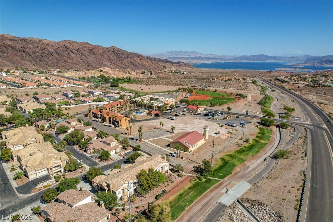 207 Kaelyn Street, #5, Boulder City, NV 89005 A striking neighborhood setting bordered by rugged desert mountains and water views.