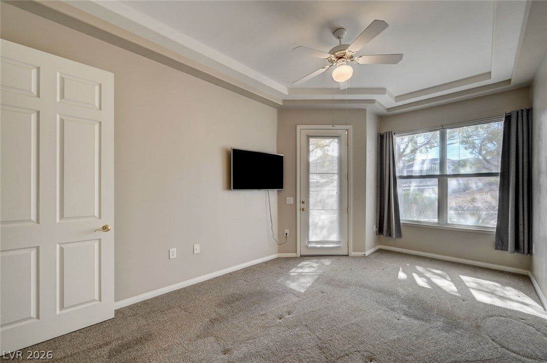 207 Kaelyn Street, #5, Boulder City, NV 89005 An elegant tray ceiling and soft carpeting define this inviting space.