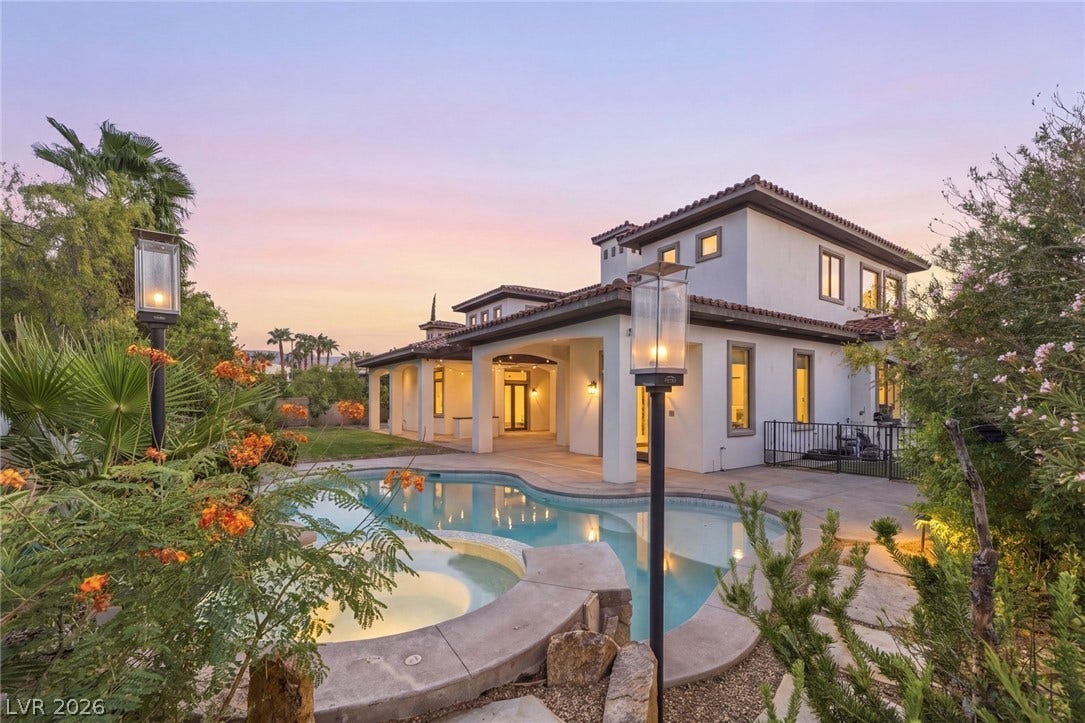 A resort-style swimming pool and spa grace the backyard of this multi-level Mediterranean estate.
