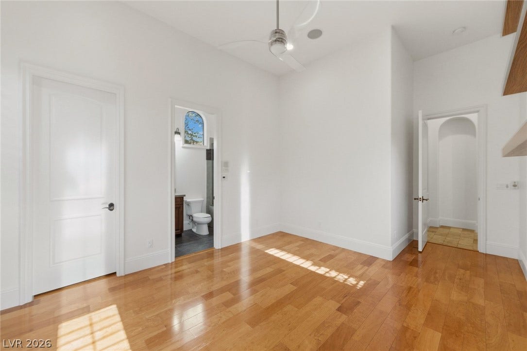 Polished hardwood flooring and soaring high ceilings define this versatile modern space.