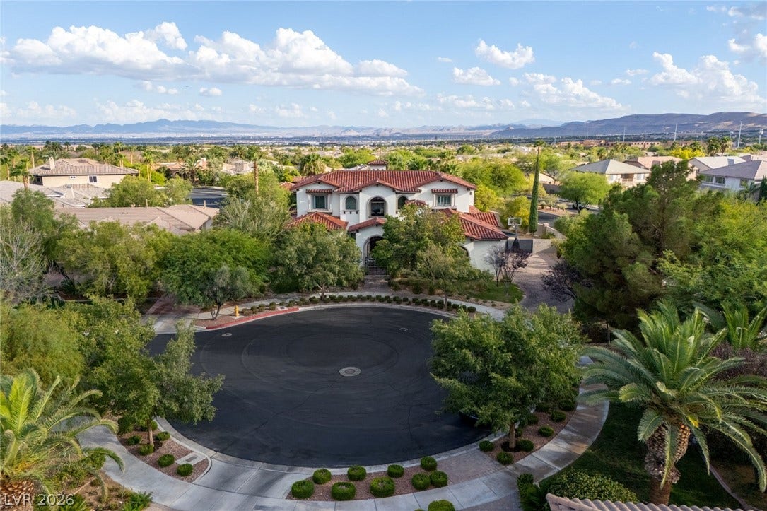 An elegant tile-roofed estate commands a prime position overlooking the sweeping valley landscape.