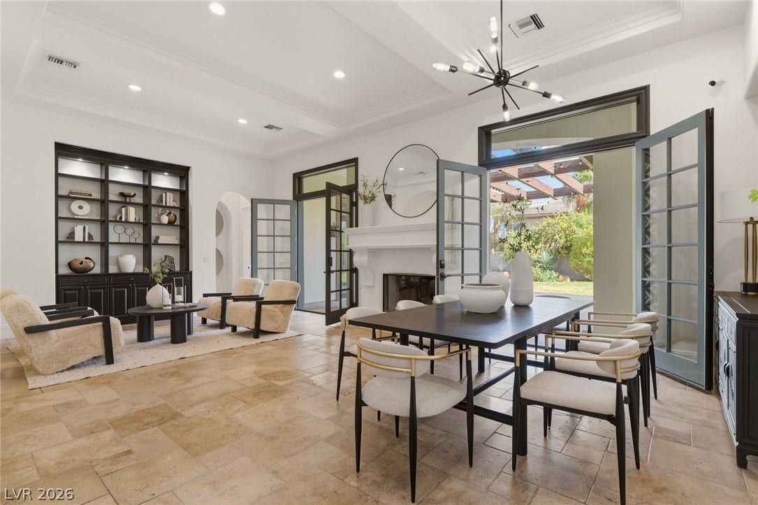 French doors open to the patio from this spacious dining and living area.