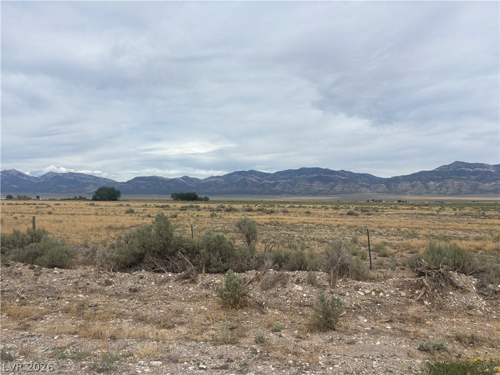 Preston Dump Road, Ely, NV 89301 Vast open horizons offer a picturesque backdrop of rugged mountains under an expansive sky.