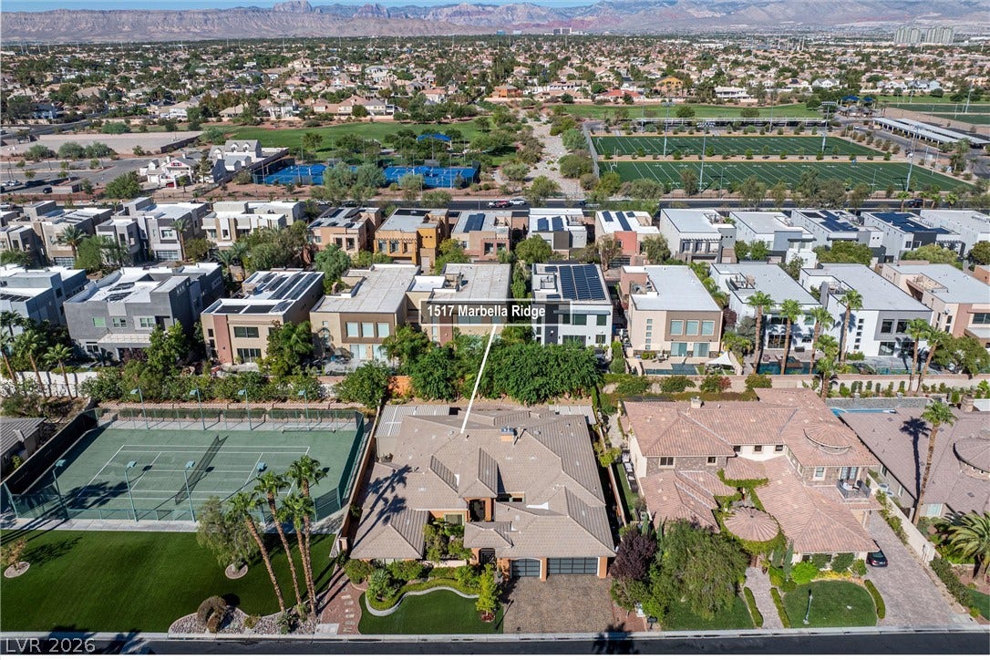 1517 Marbella Ridge Court, Las Vegas, NV 89117 An elevated perspective showcases the surrounding neighborhood and majestic mountain backdrop.
