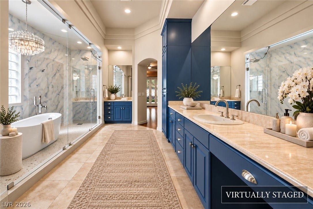 1517 Marbella Ridge Court, Las Vegas, NV 89117 Stone countertops and custom cabinetry define this elegant bathroom space complete with a walk-in shower.
