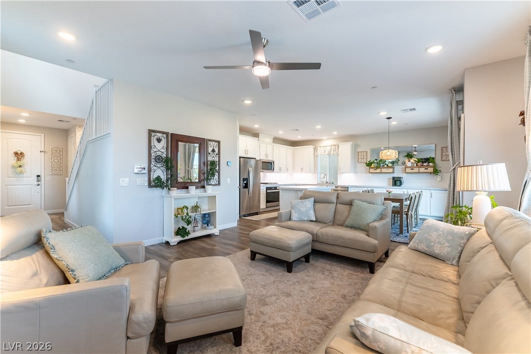 10583 Valletta Avenue, Las Vegas, NV 89166 Rich wood-look flooring and an airy open layout seamlessly connect the main living spaces.
